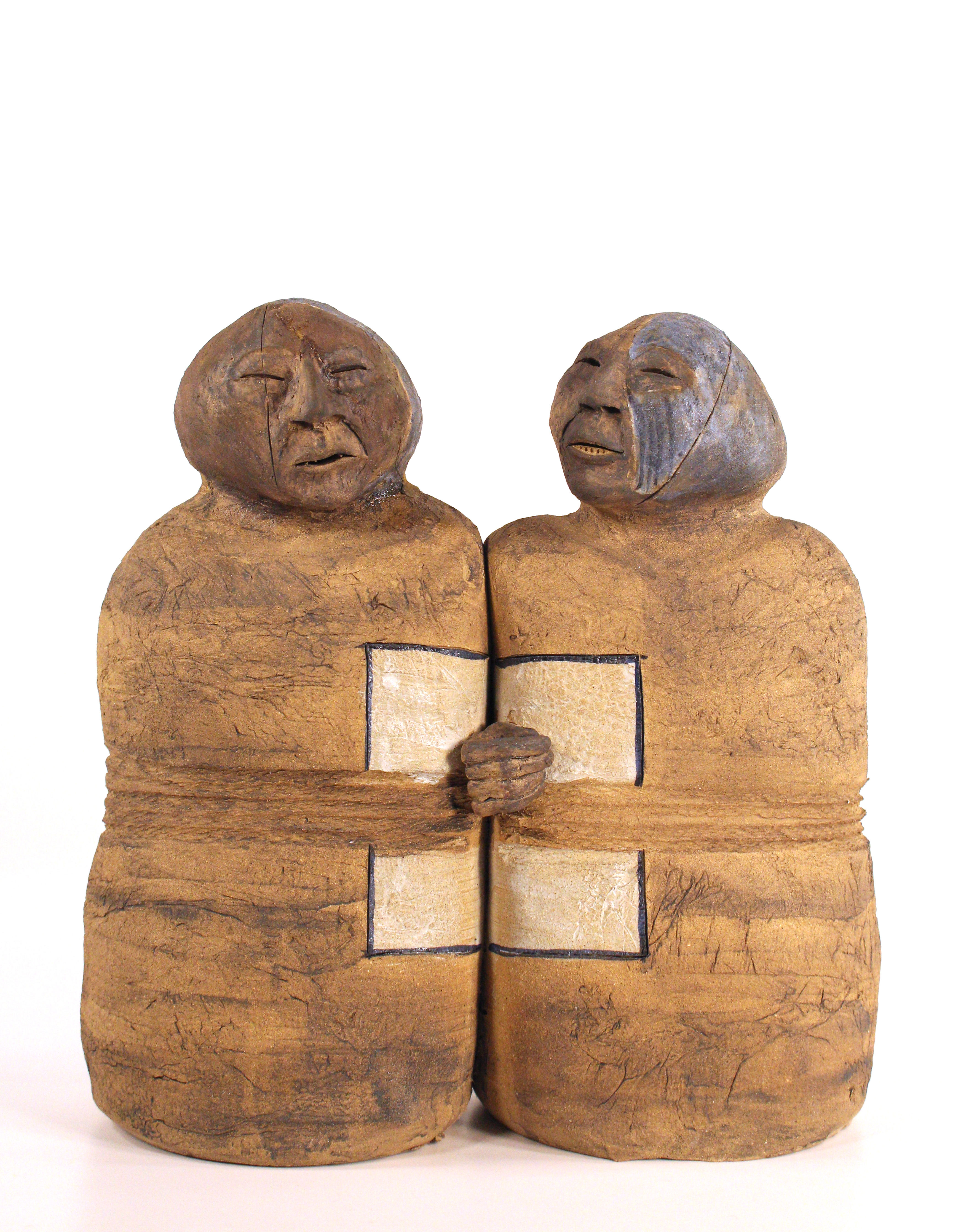 Ceramic abstract figures adjacent to each other, holding hands