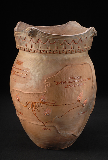 Brown clay pot with a round bulbous bottom and a map of new york state etched on the surface