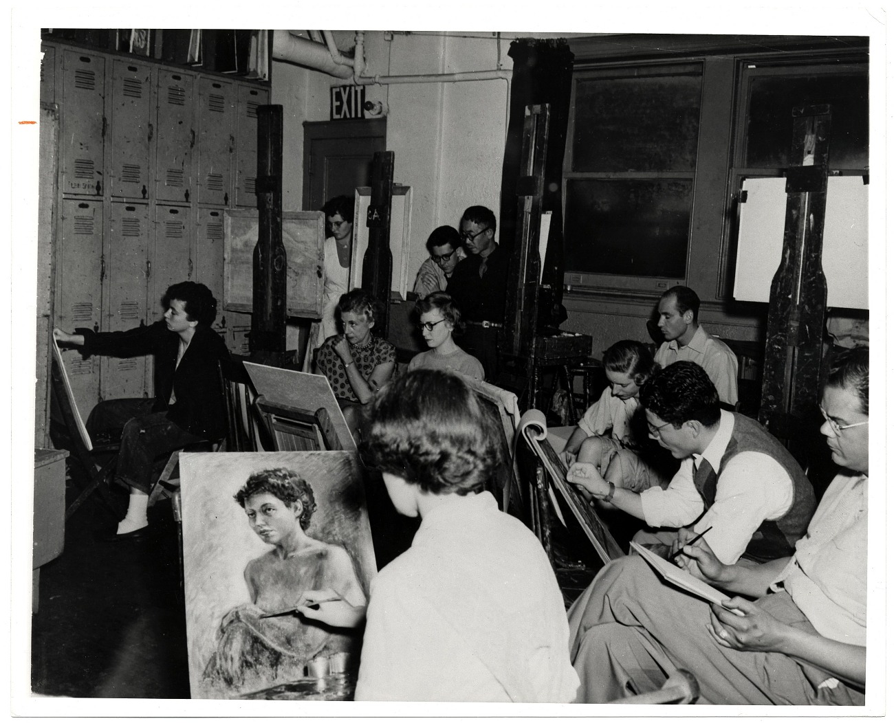 A class of art students focused on painting at the Art Students League of New York.