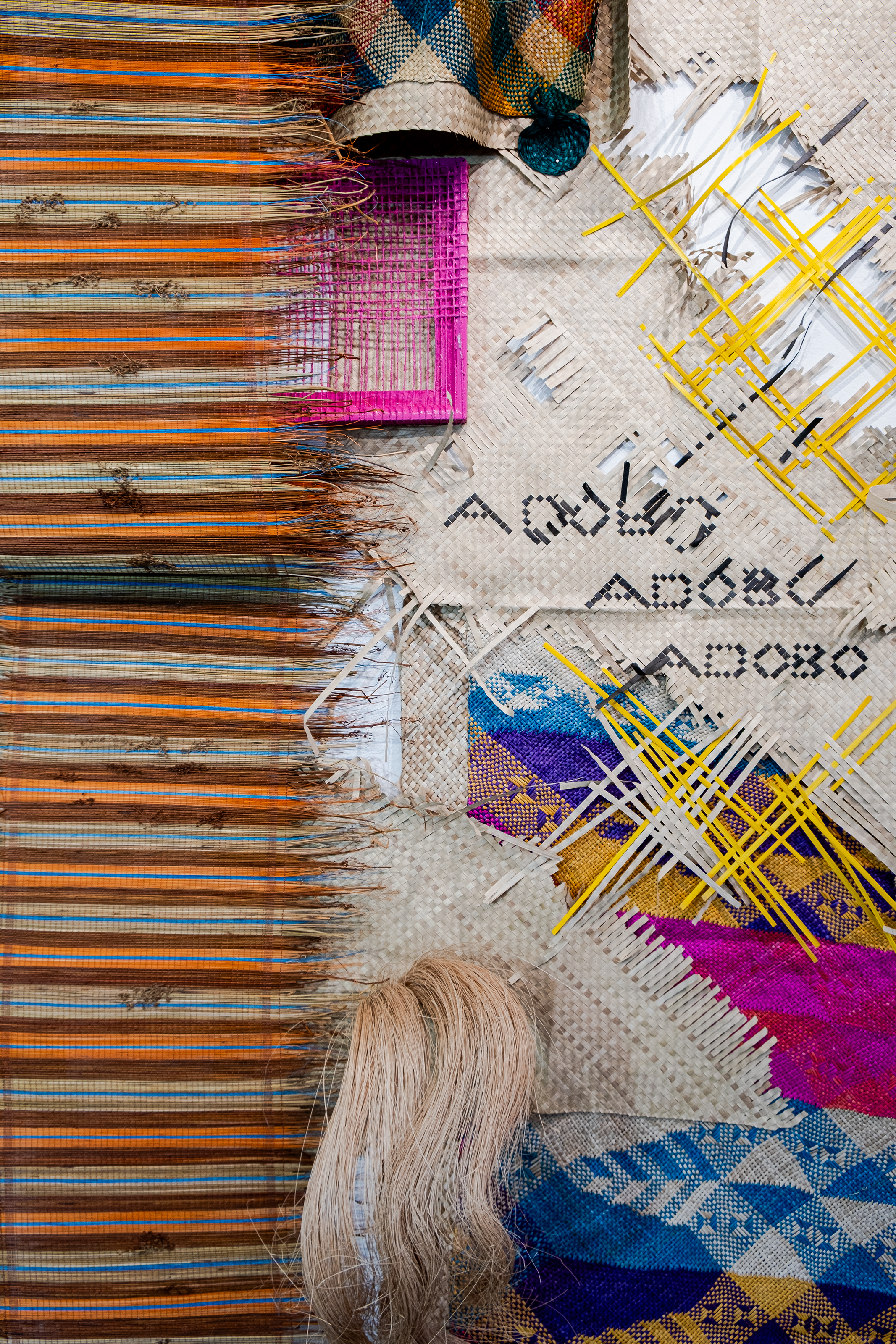 A collage of different textiles and woven material including bang, a traditional Filipino woven mat.